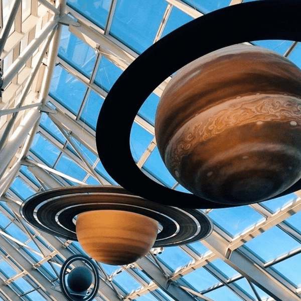 Model planets hanging from the atrium ceiling