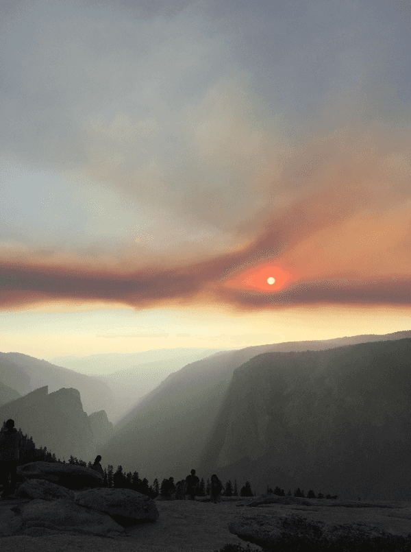 A smoke-hazed sunset over the valley